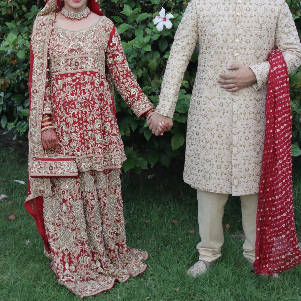 Pakistani traditional bridal Red lehenga with peplum top and dupatta